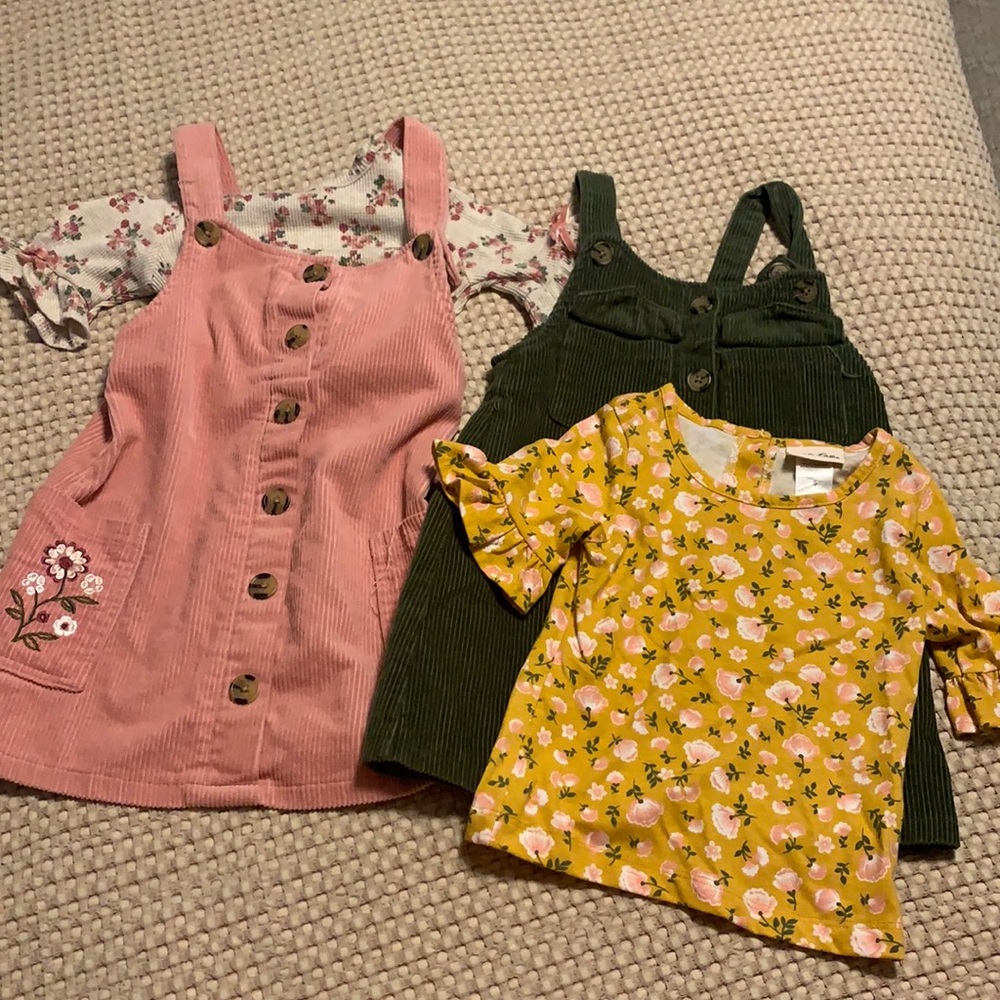 Two dressed with shirts that go underneath